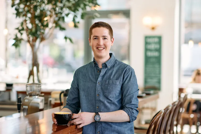 Headshot of Tatte's coffee trainer Sam MacNeill